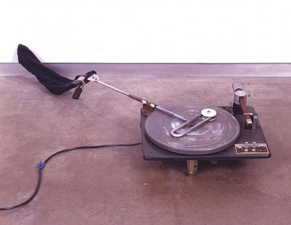 Disc Plate, 2005
Record player parts, mechanical parts, transformer, motion sensor, sock
6 1/2 x 19 x 44 inches