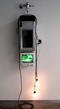 Shooting the Curl
2001
TV, VCR, microwave, plumbing hardware, light bulbs, electrical hardware
75 x 11 x 15 inches